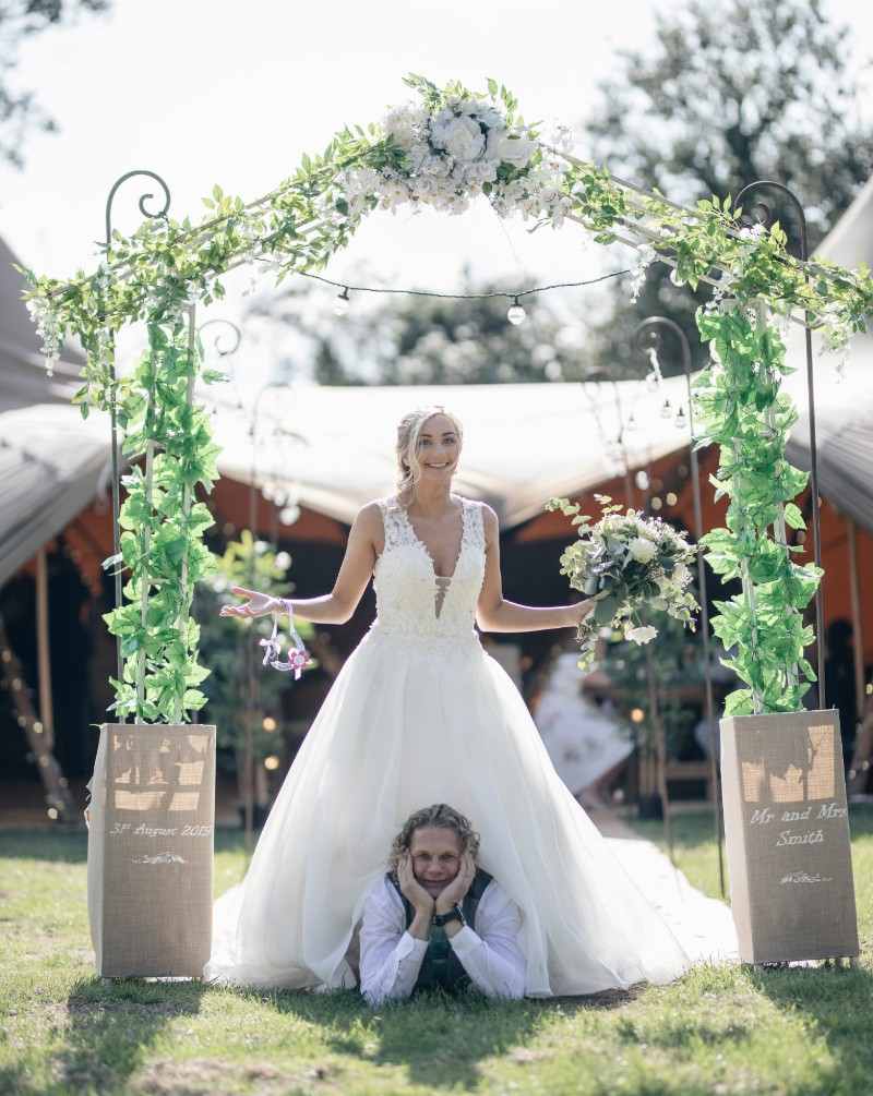 flower-arch-bride-groom-rustic-wedding